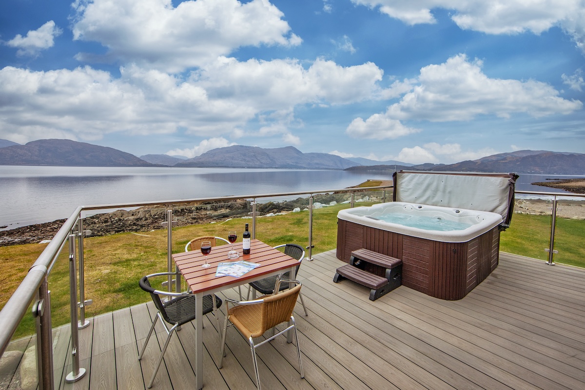 A lodge deck looking out over Loch Linnhe and the mountains